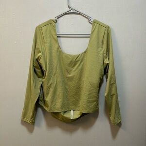 Green Fabletics moisture-wicking top. Built-in bra and open back.